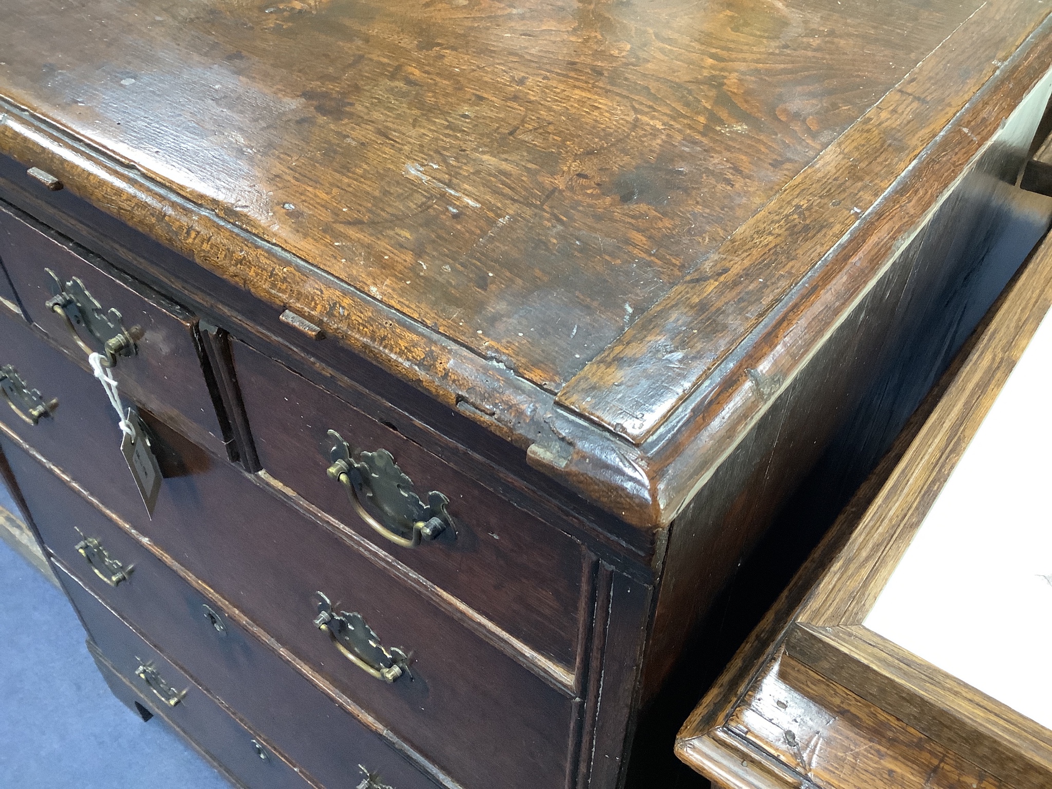 A Queen Anne oak chest fitted three short drawers and three long drawers, width 76cm, depth 49cm, height 98cm